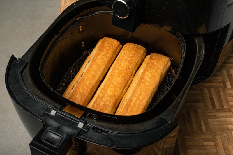Air fried suasuage rolls in air fryer basket