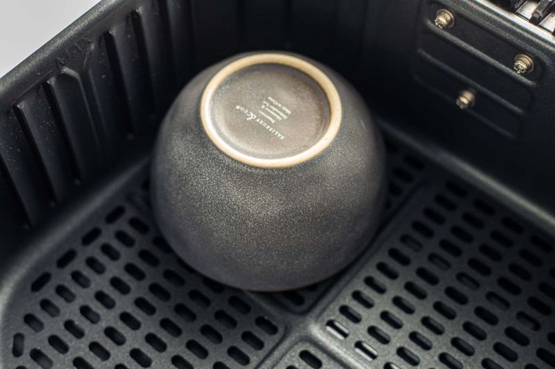 Upside down bowl in air fryer basket Upside down bowl in air fryer basket