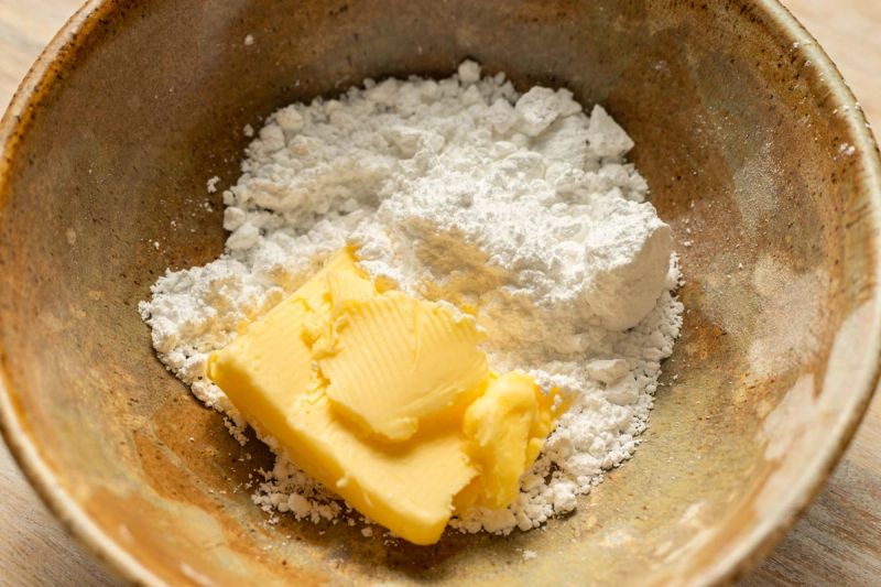 Butter and icing sugar in a bowl Butter and icing sugar in a bowl