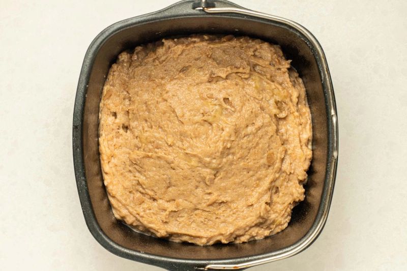 banana bread batter in a baking tin banana bread batter in a baking tin