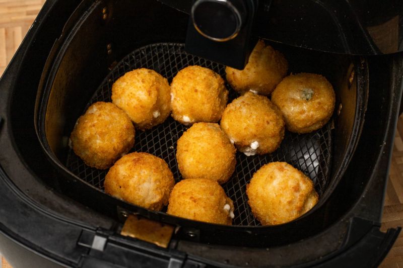 Semi-cooked chicken balls in air fryer