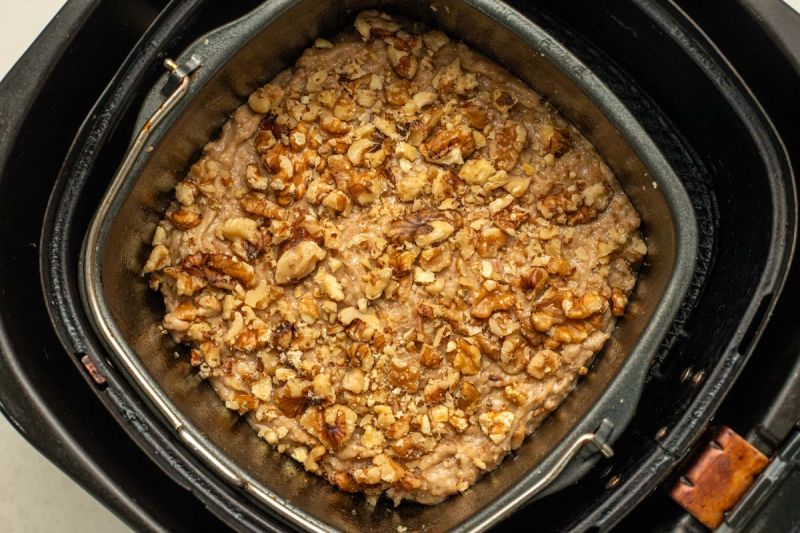 Raw banana bread in air fryer basket