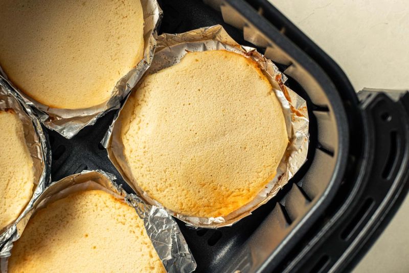 Flipped pancakes in air fryer basket Flipped pancakes in air fryer basket