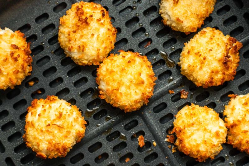 Semi cooked goats cheese in air fryer basket Semi cooked goats cheese in air fryer basket