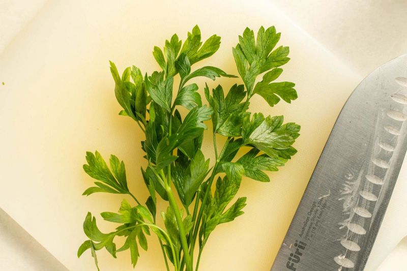 Fresh parsley on a chopping board Fresh parsley on a chopping board
