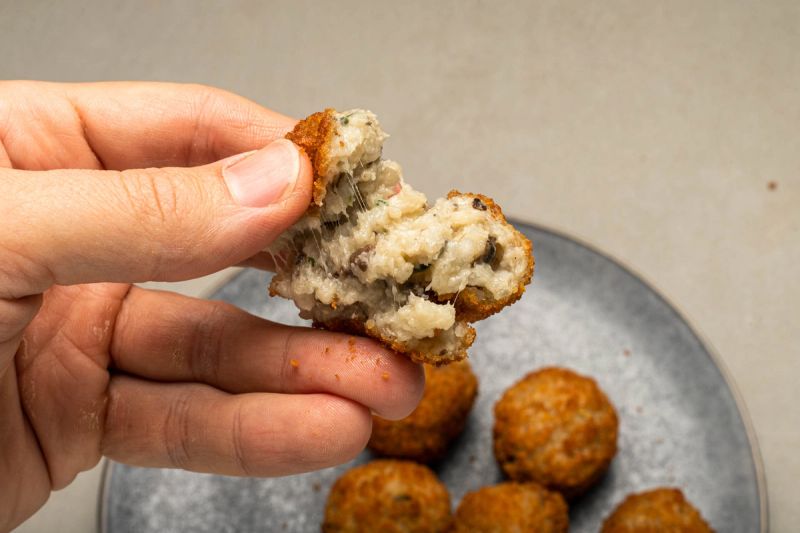 Air fried arancini ball split open Air fried arancini ball split open
