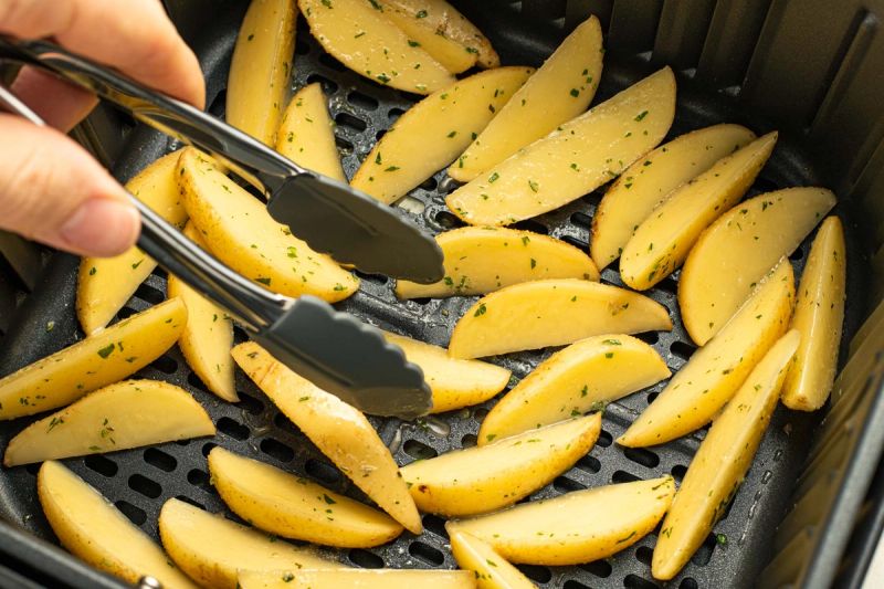 Potato wedges in air fryer basket