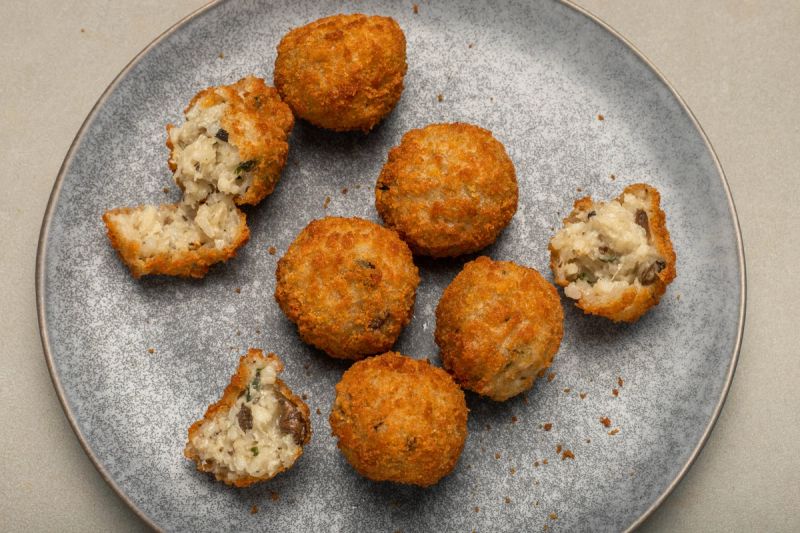 Air fried arancini on a plate
