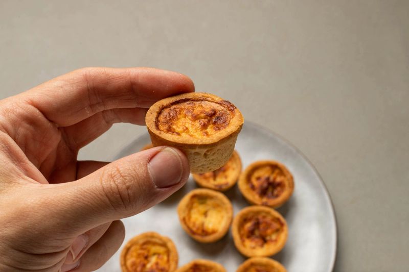Holding an air fried mini quiche