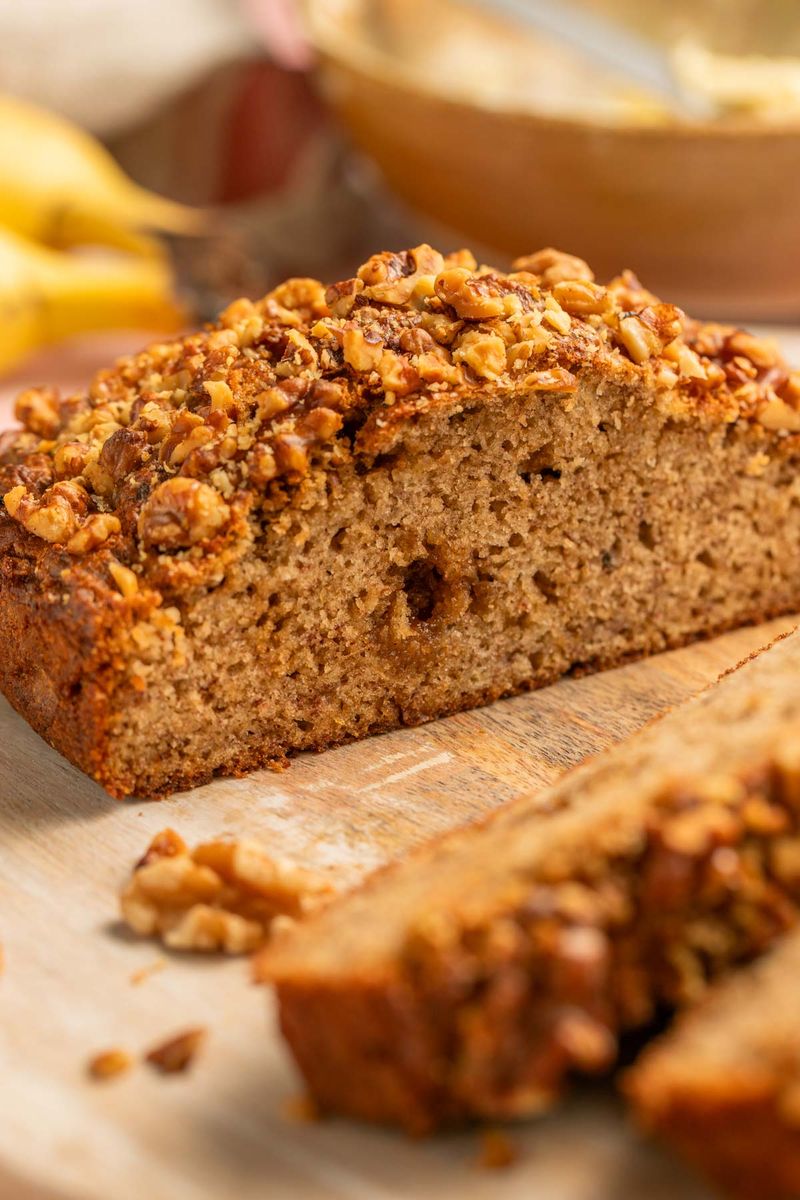 banana bread with walnuts on serving board
