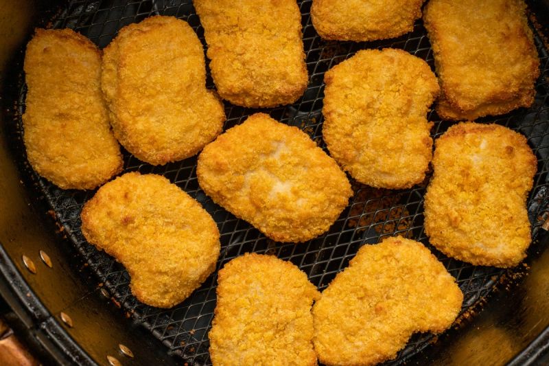 Chicken nuggets in air fryer basket