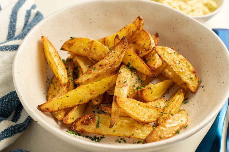 Air fried potato wedges in a bowl