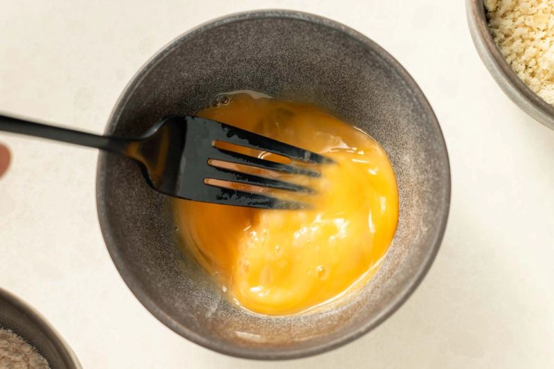 Beating an egg in a bowl