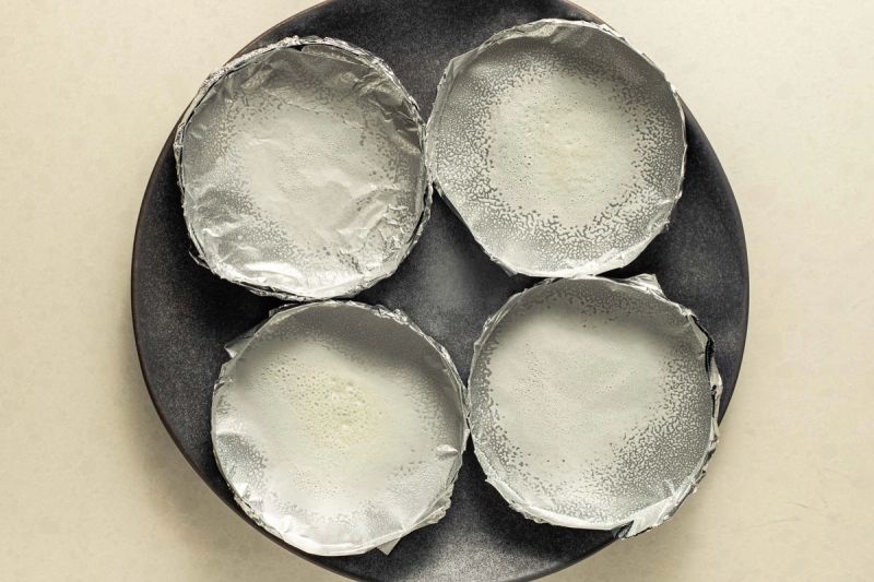 Trays sprayed with oil