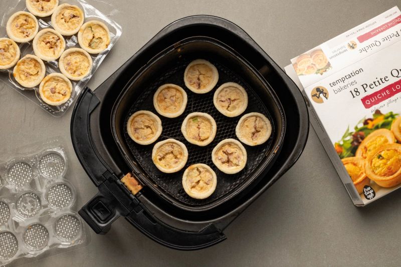 Mini quiches in an air fryer basket