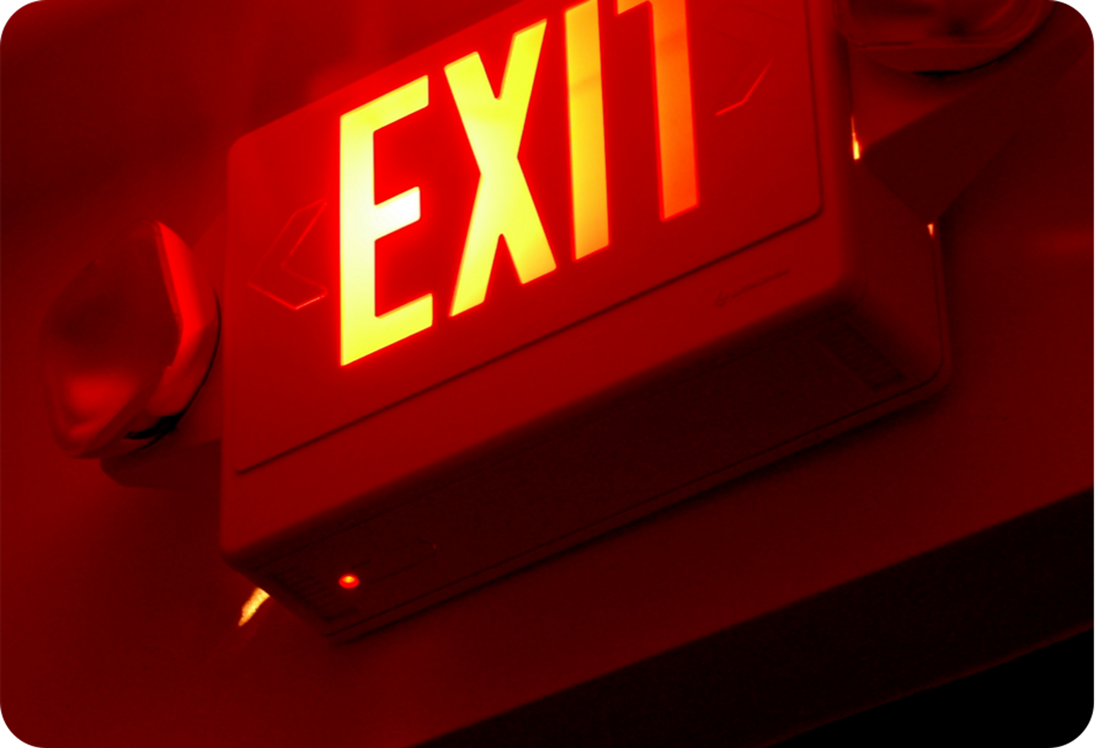 Picture of "EXIT" sign glowing red 