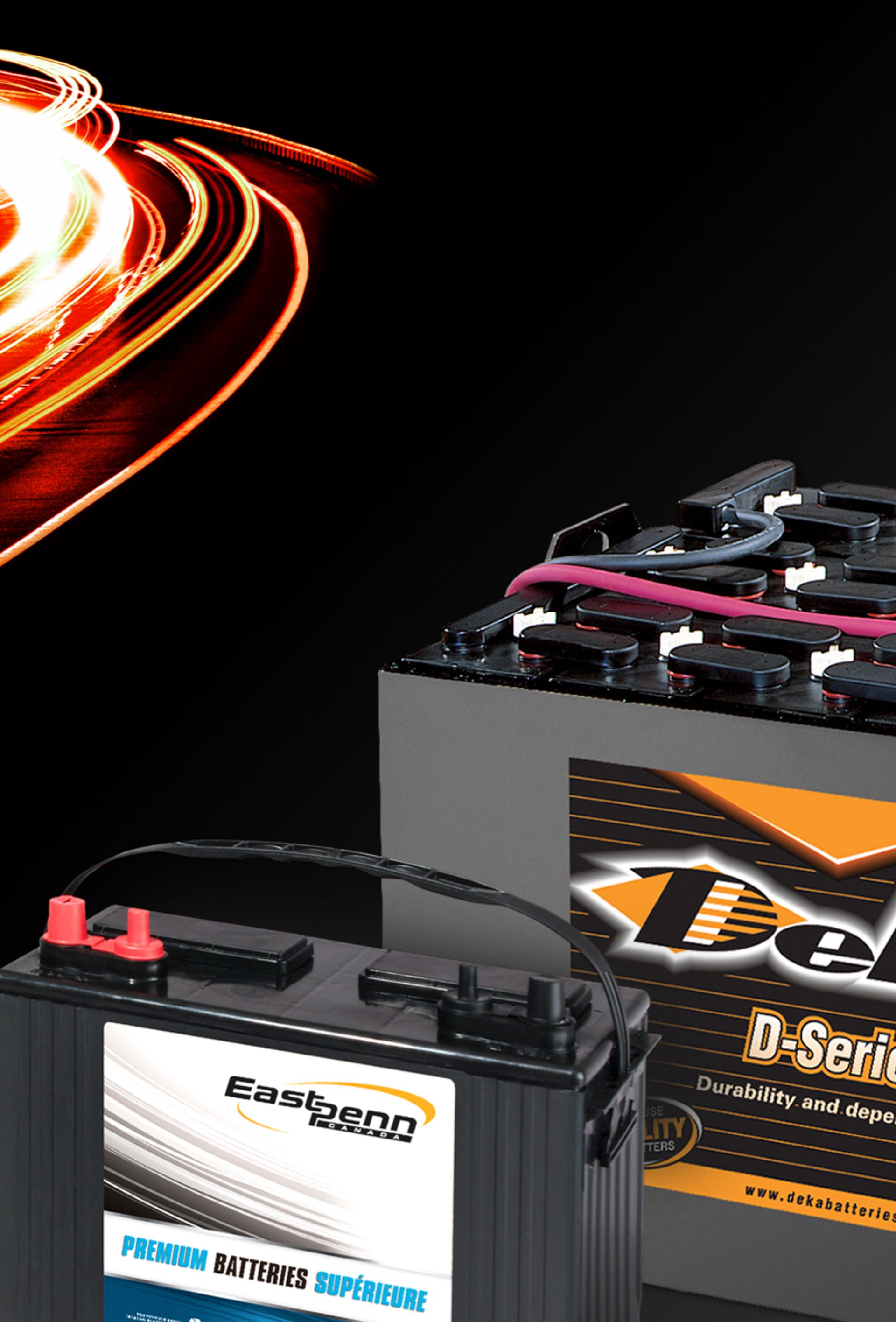 Picture of deka batteries with red light flares in motion on a black background