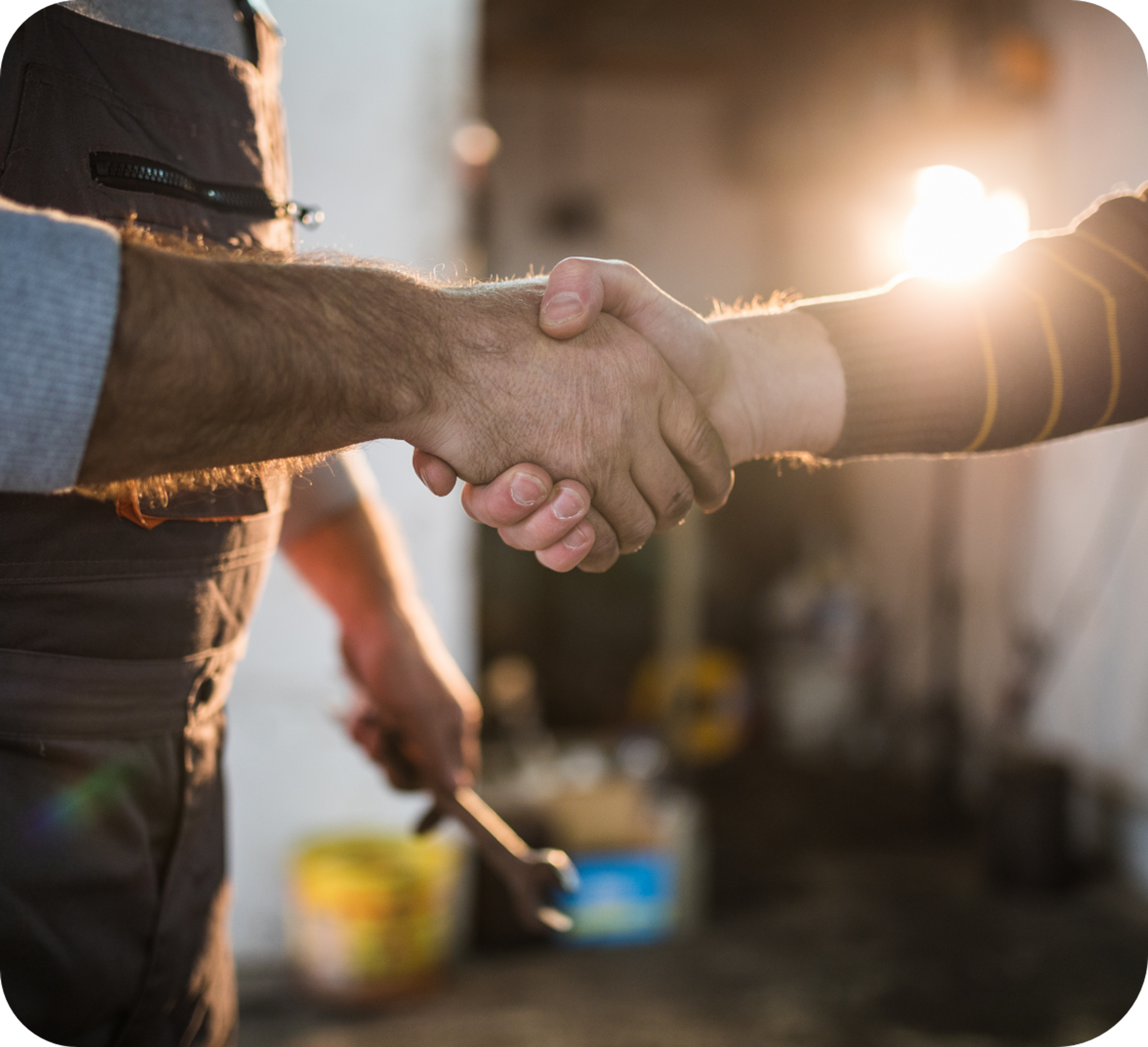Image of two men shaking hands