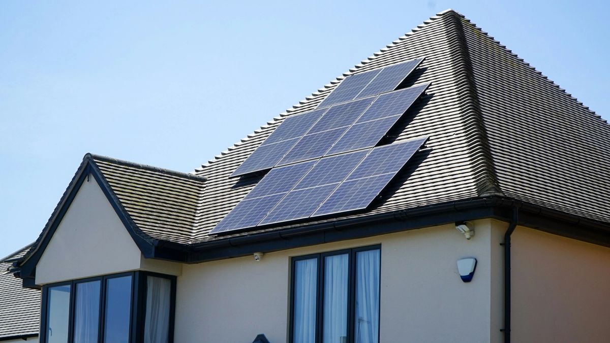 Solar panels installed on the roof of a modern family home