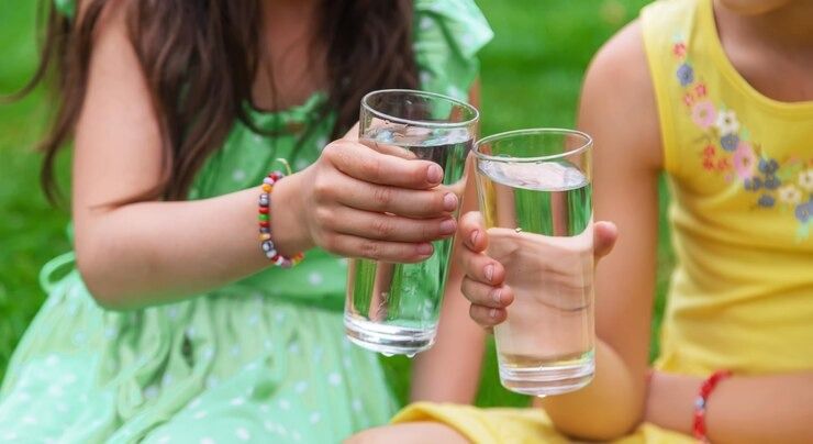 Australian family enjoying clean, filtered drinking water at home