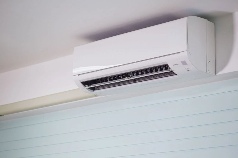 Modern wall-mounted split-system air conditioner installed in a contemporary home