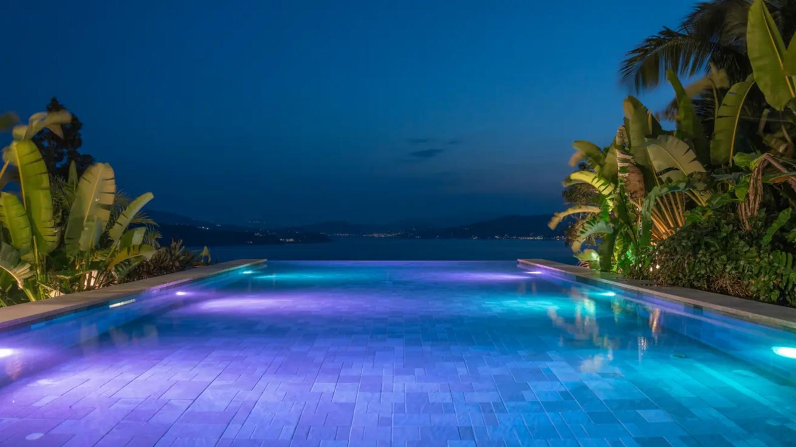 68b73891fe2deb5bd3377152 a photograph of a luxurious infinity poo Oo47mO0TRHeNz4rqw0gqgQ 7a6Zdkp T92ufBqdsGQYag