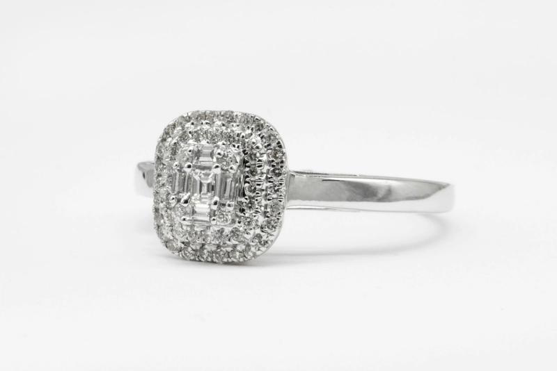 An emerald-cut diamond halo ring