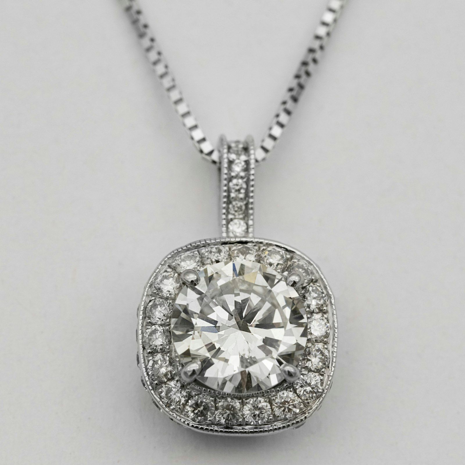 A cushion halo diamond pendant