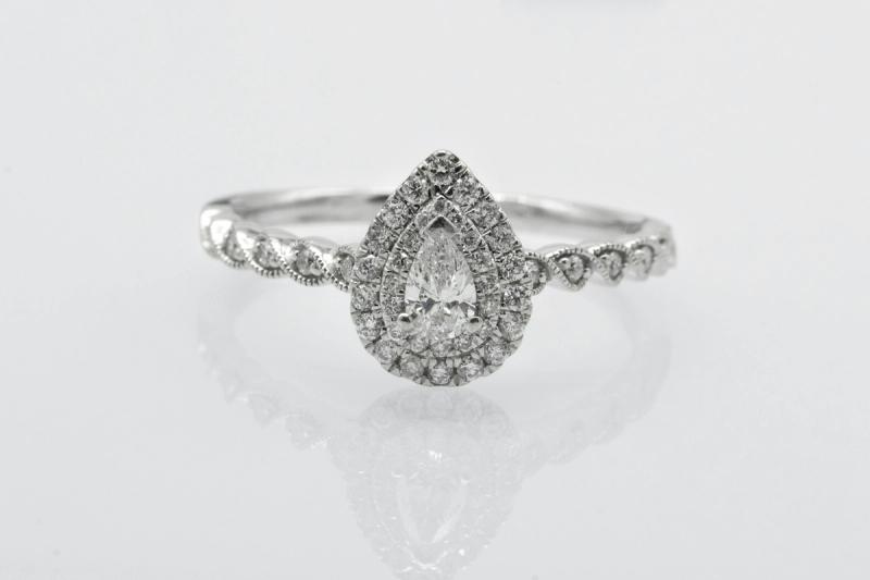 A pear-shaped diamond halo ring