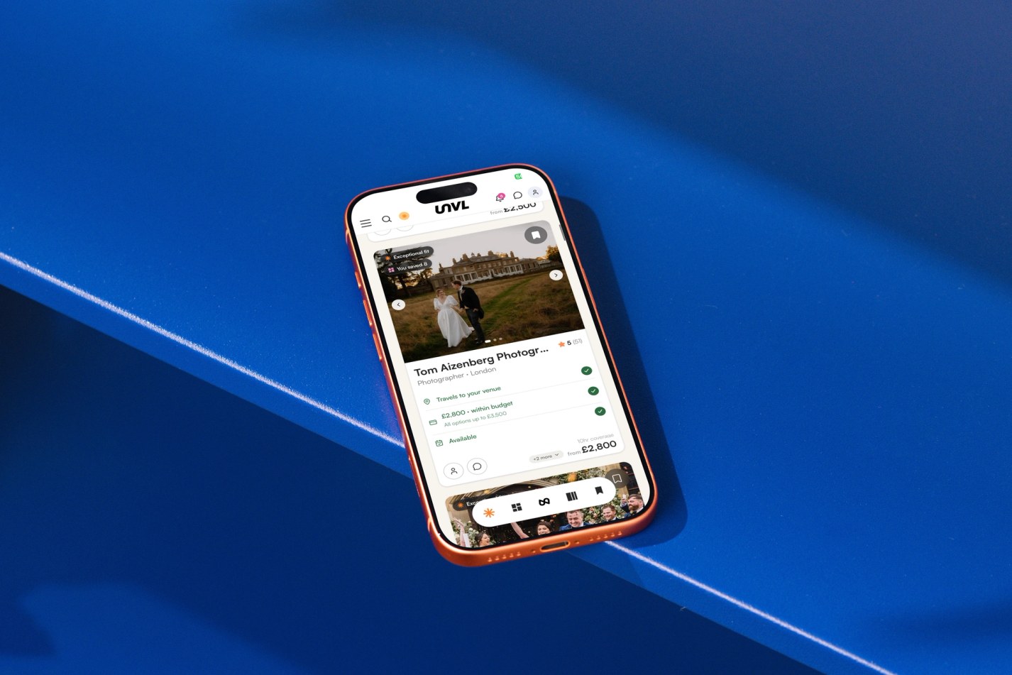 Mobile on blue surface with UNVL Match on display on screen