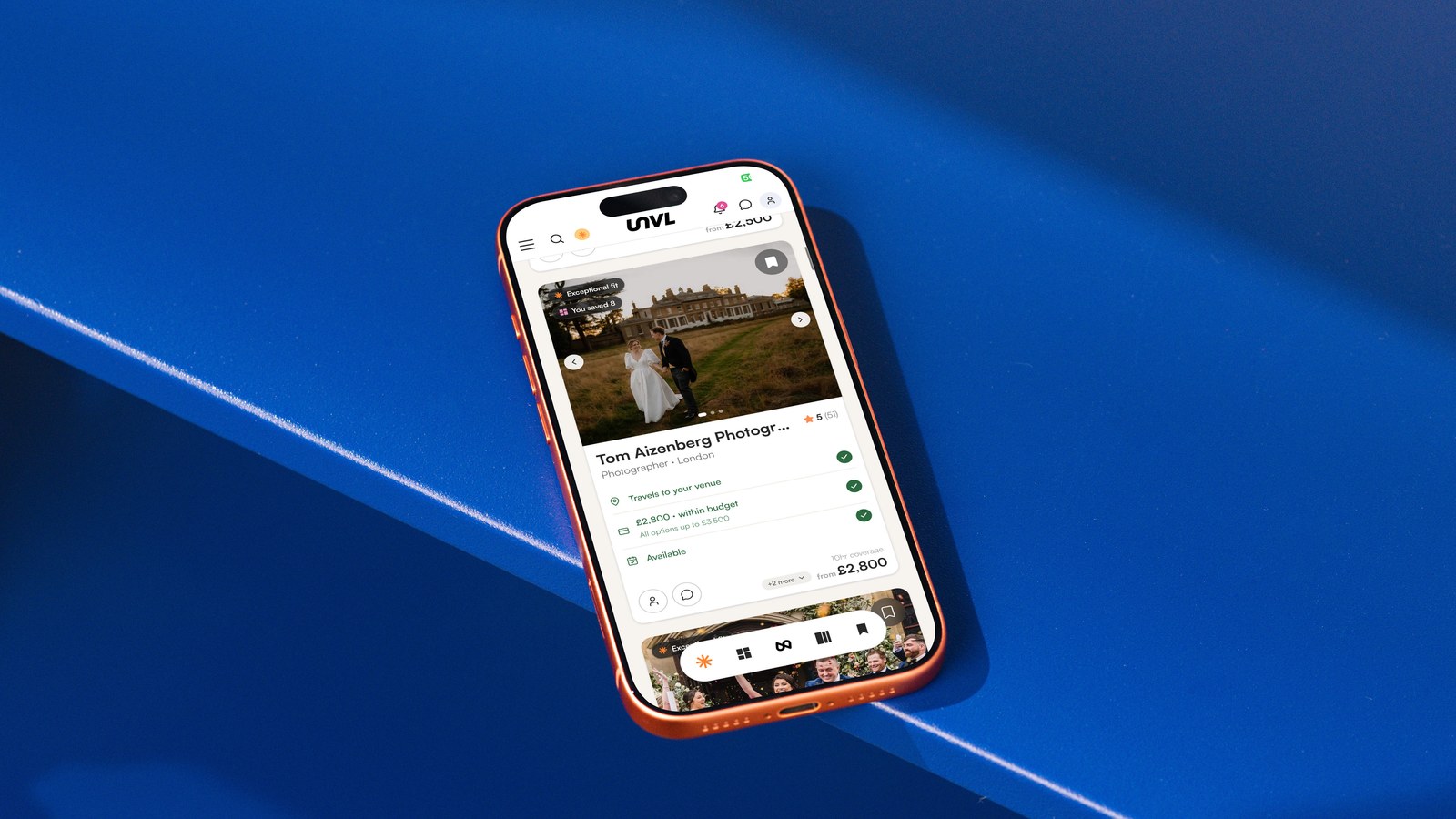 Mobile on blue surface with UNVL Match on display on screen