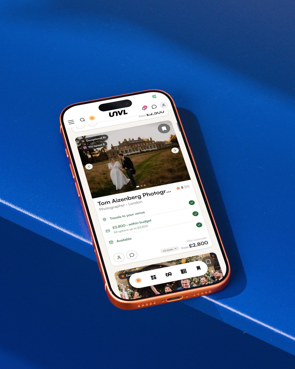Mobile on blue surface with UNVL Match on display on screen
