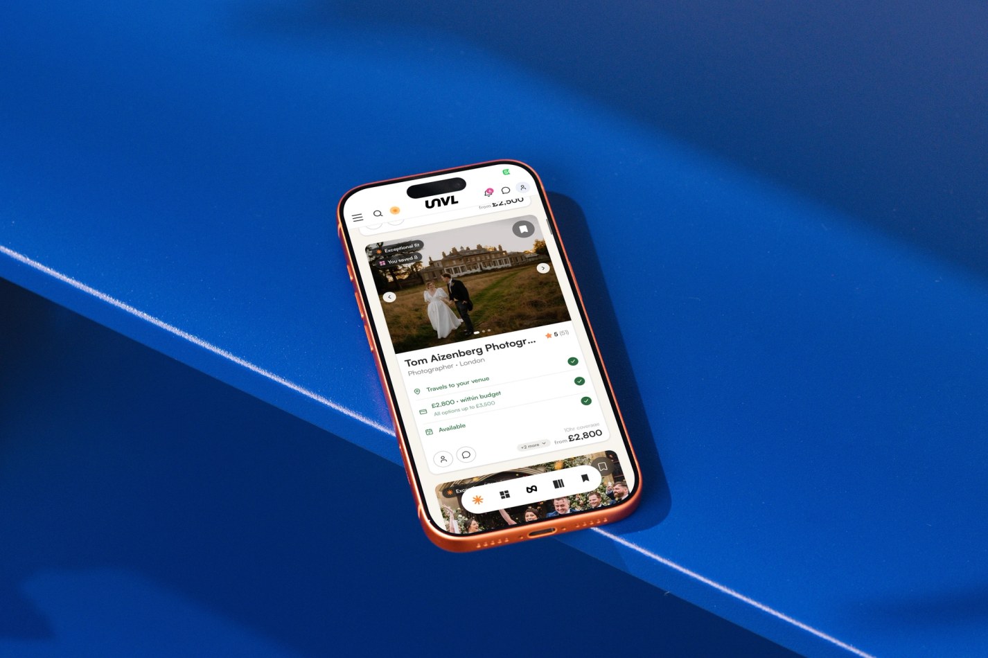 Mobile on blue surface with UNVL Match on display on screen