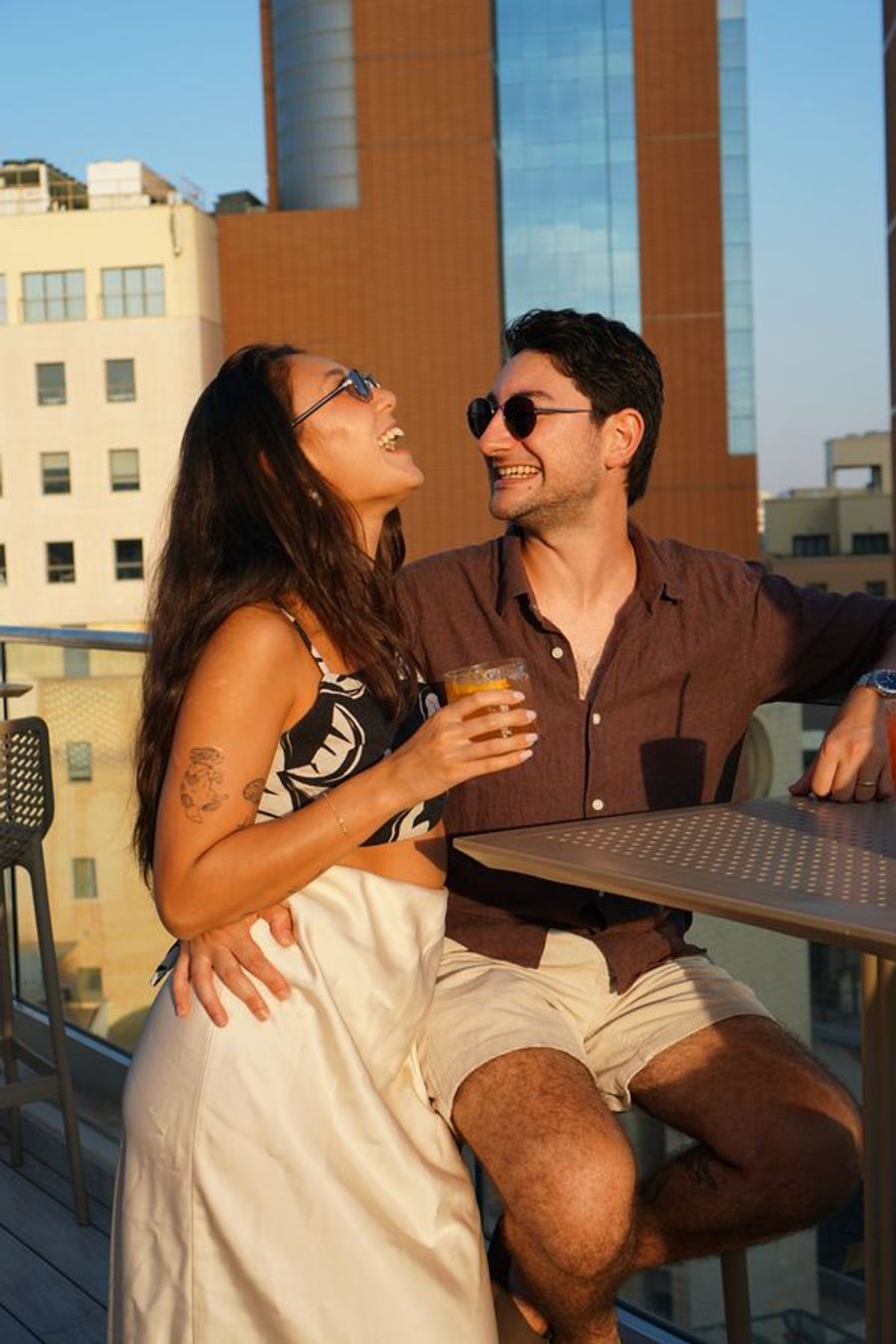 Couple at rooftop at golden hour