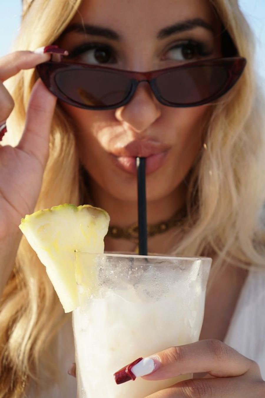 Cocktail with pineapple garnish