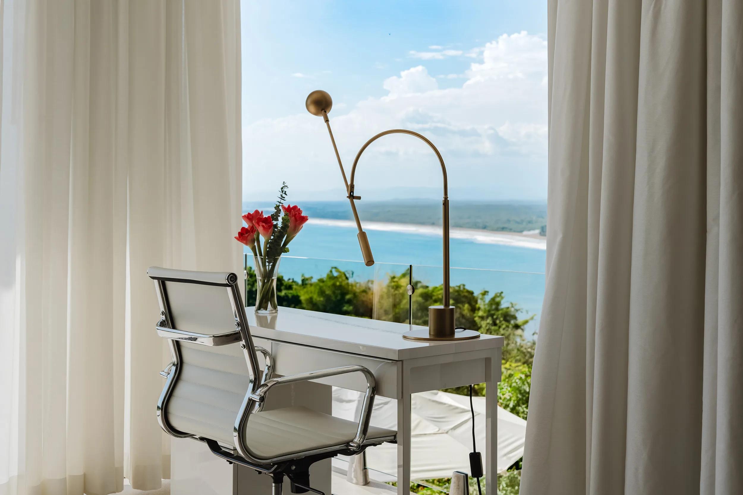 Desk by the window at Casa Nola looking down the coast to the beach