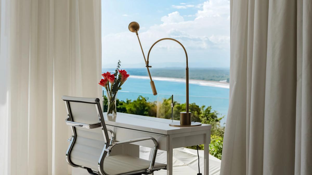 Desk by the window at Casa Nola looking down the coast to the beach