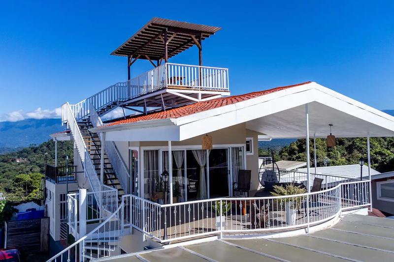 Rooftop lookout tower above the covered terrace with mountains beyond at Casa Alta Vista