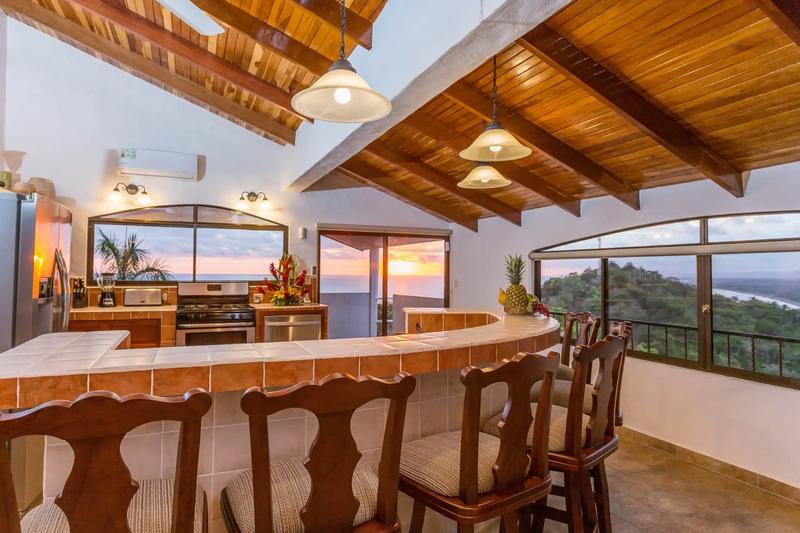 Casa Moreno kitchen and tile bar glowing at sunset with ocean views