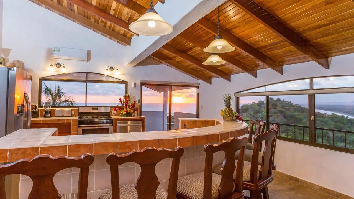 Casa Moreno kitchen and tile bar glowing at sunset with ocean views