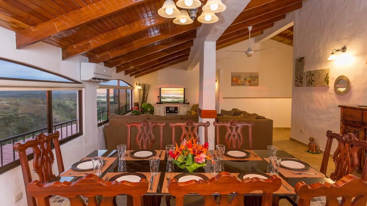 Casa Moreno dining table looking toward the living area and television