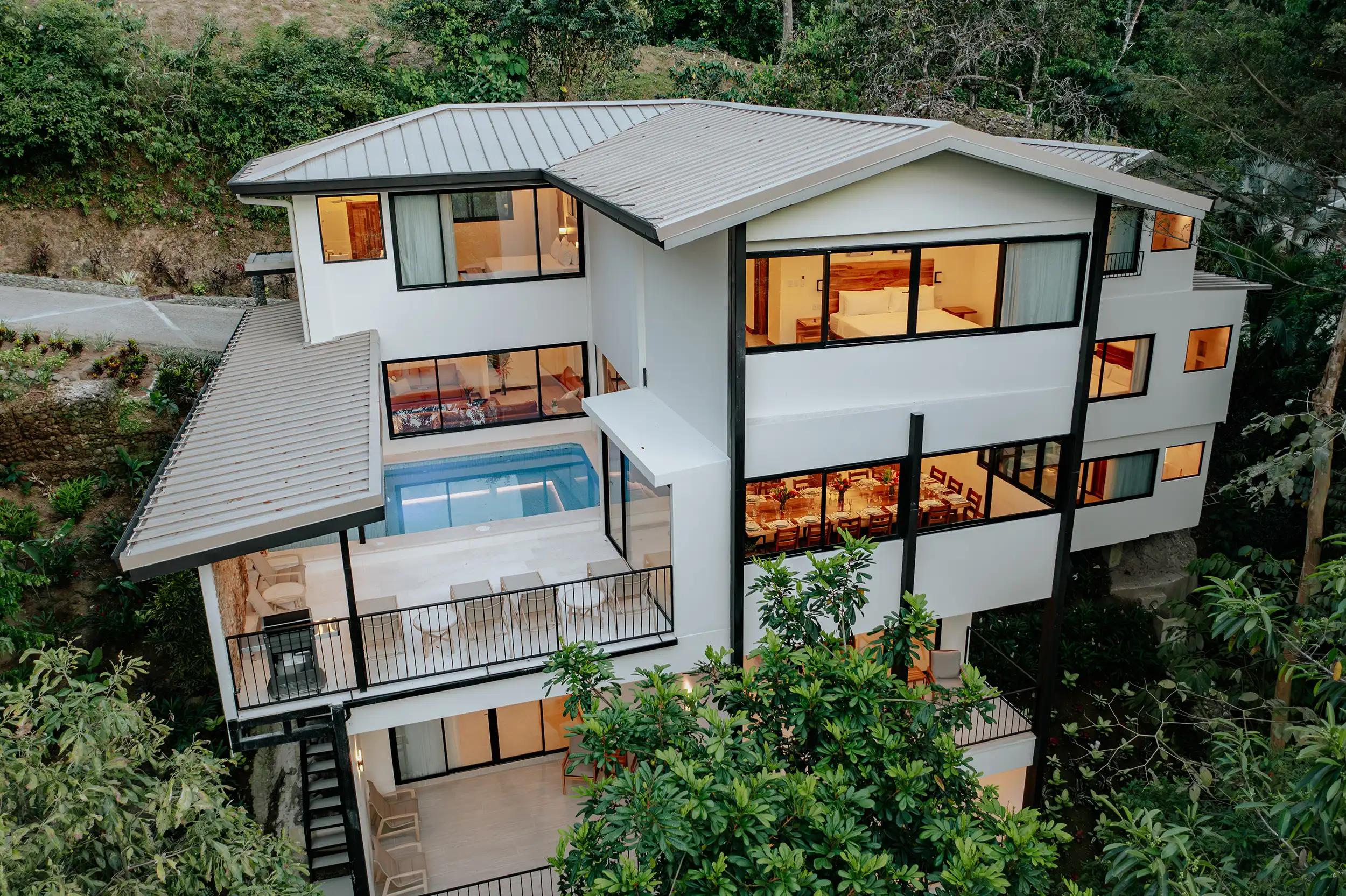 Aerial view of the three story Casa Dos Cascadas villa at twilight
