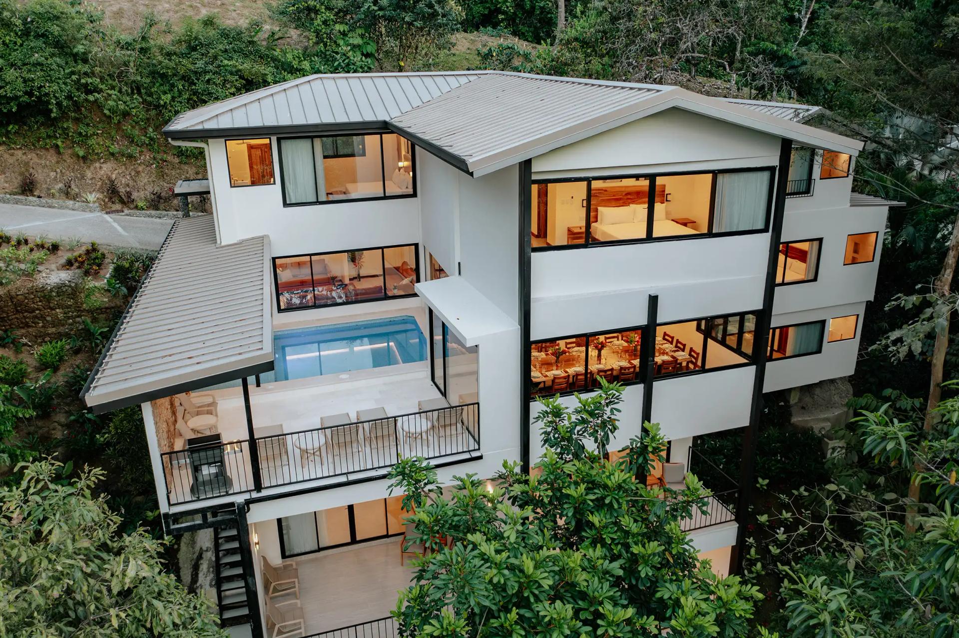 Aerial view of the three story Casa Dos Cascadas villa at twilight