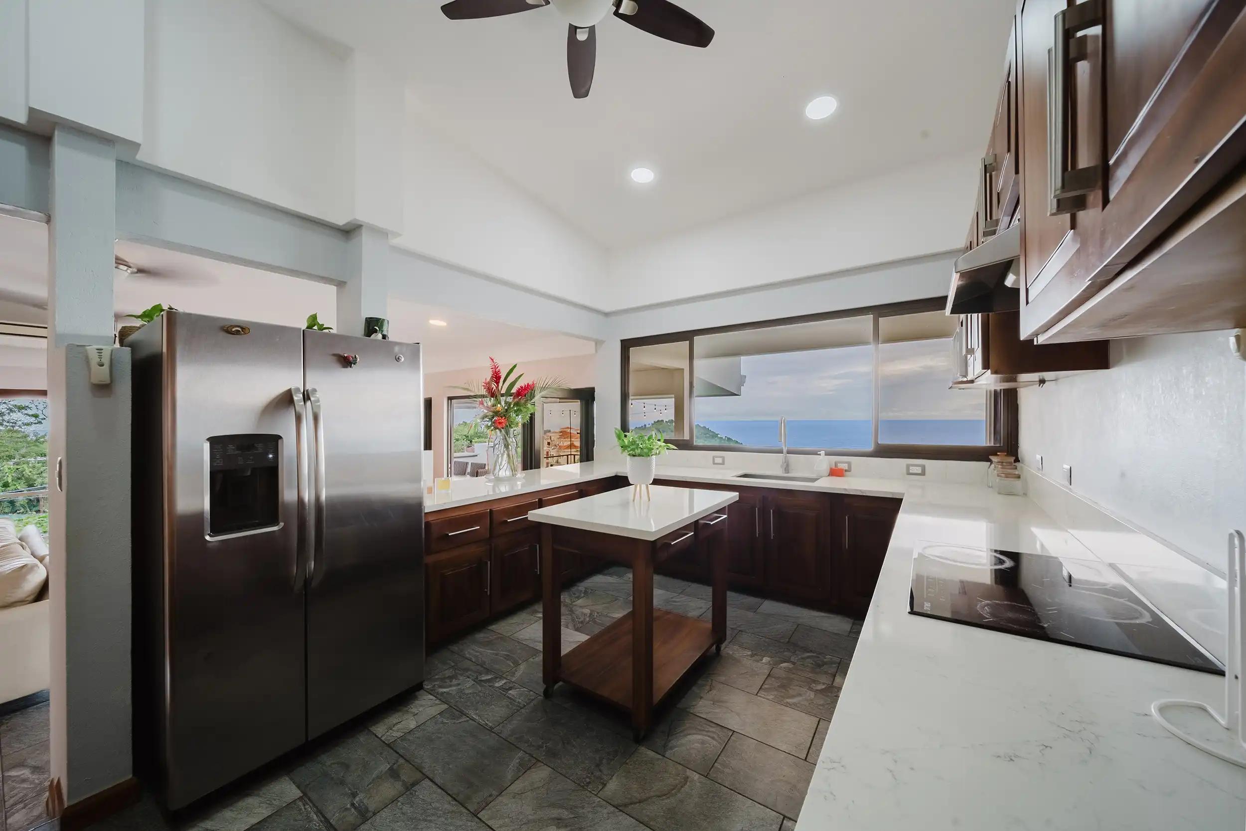 Kitchen at Casa Grande Vista with island cart, quartz counters and ocean view