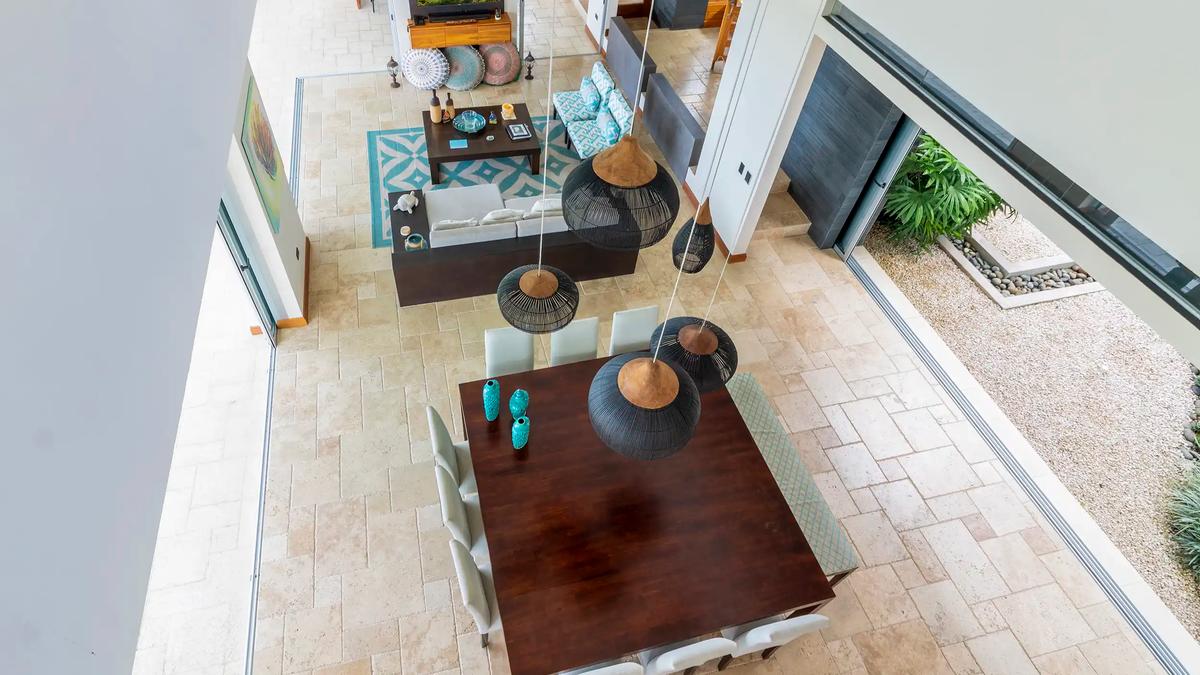 Living and dining areas of Casa Contee seen from the upstairs walkway