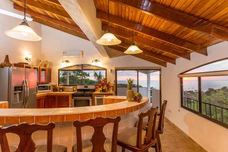 Breakfast bar with pineapple at Casa Moreno as the sun sets over the Pacific