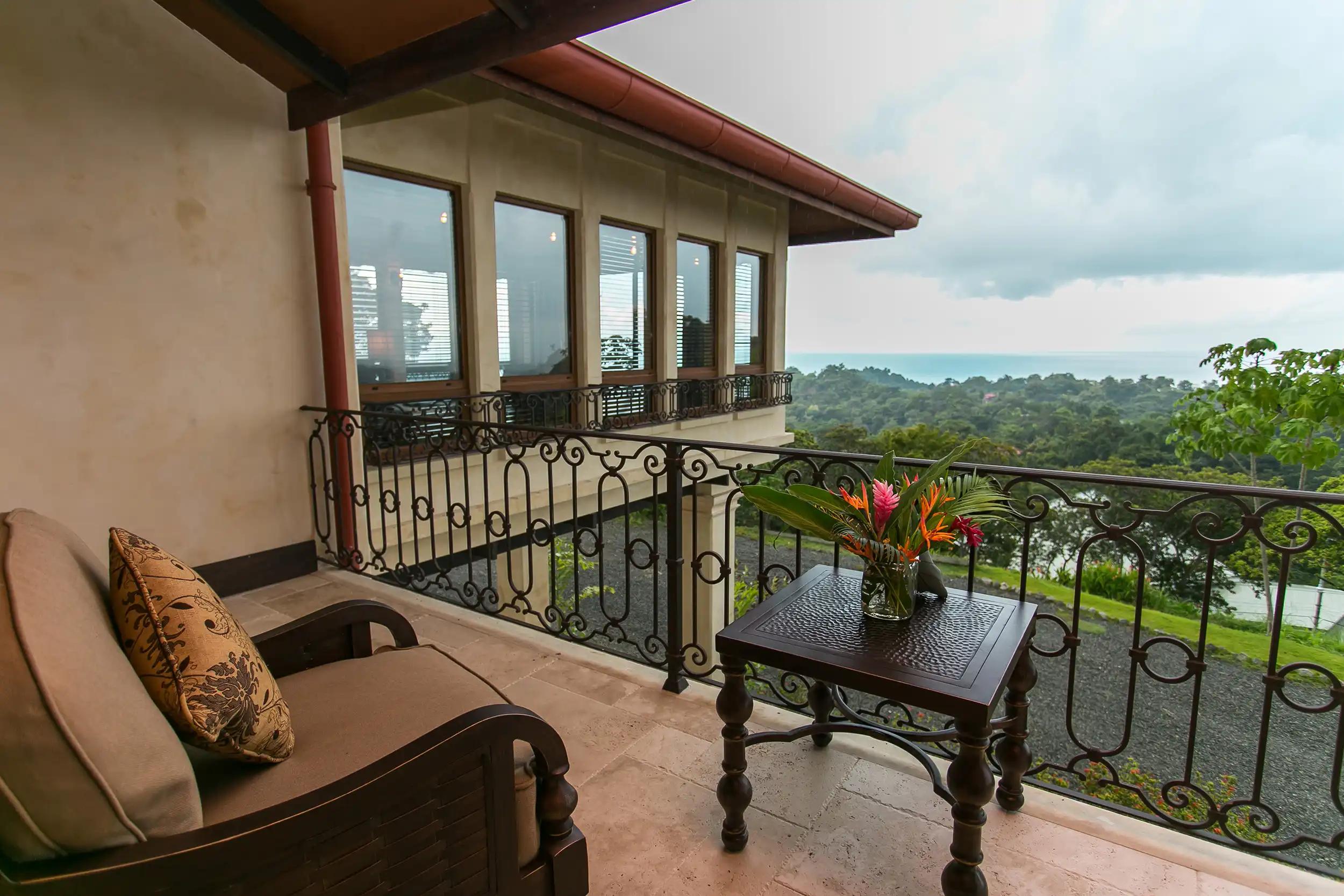Private balcony at Villa Marbella overlooking jungle canopy and the Pacific
