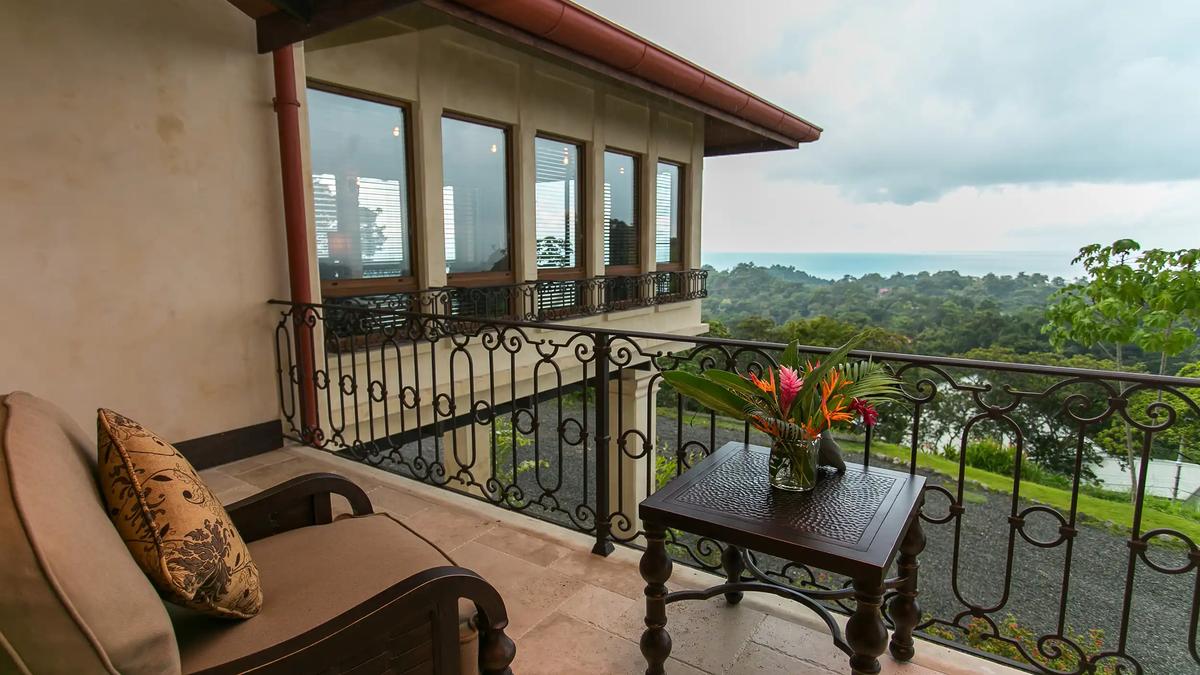 Private balcony at Villa Marbella overlooking jungle canopy and the Pacific