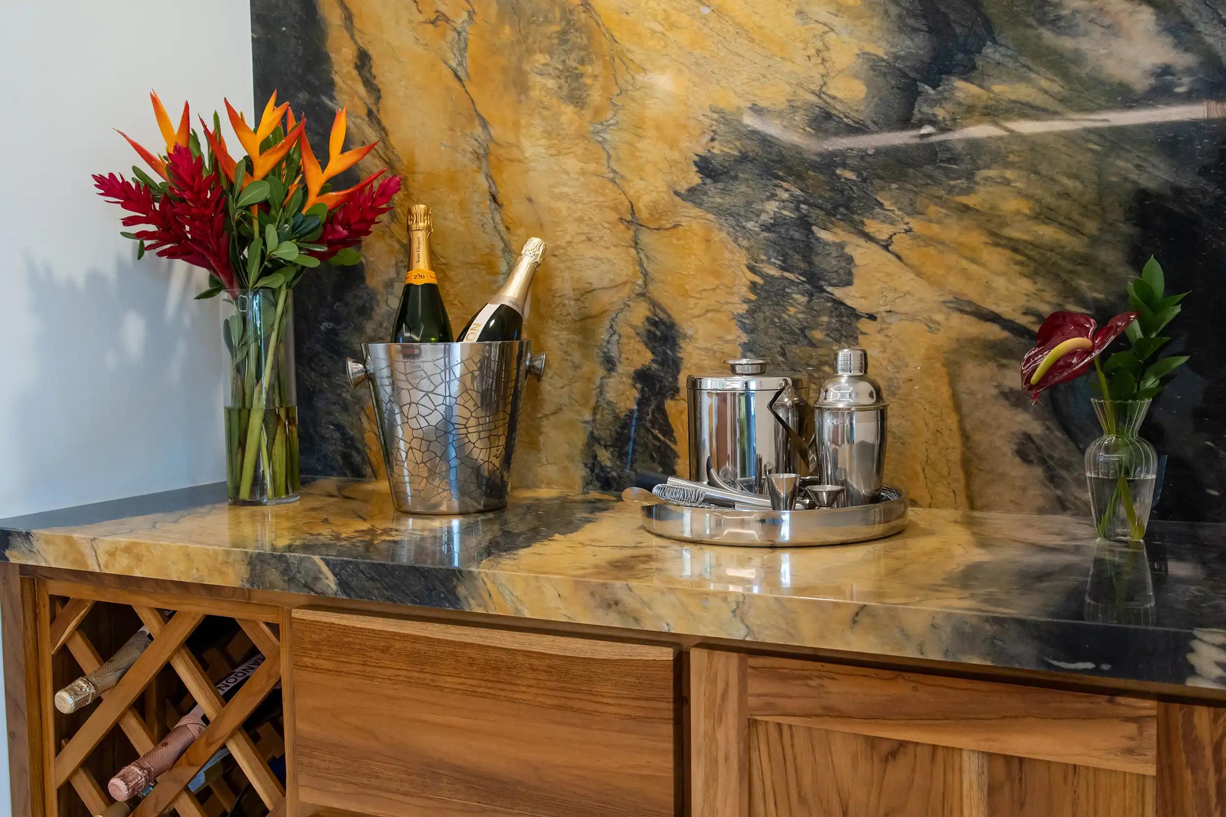 Champagne bucket and cocktail set on the granite bar counter at Casa Rambutan