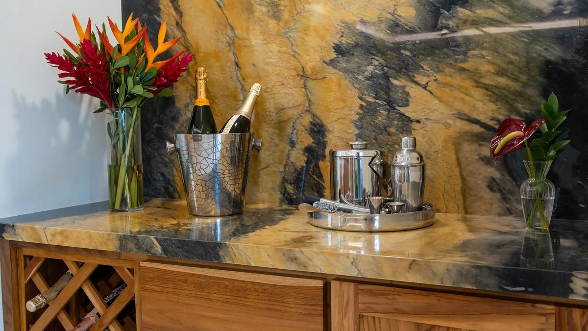 Champagne bucket and cocktail set on the granite bar counter at Casa Rambutan
